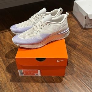 NWT Women’s Nike Odyssey React Flyknit, size 9, in platinum tint/white.